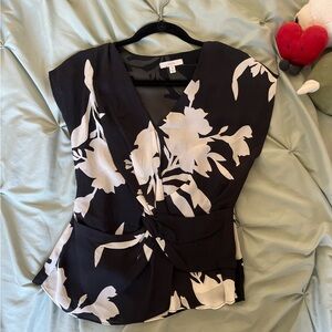 Black and white floral blouse with tie in the middle